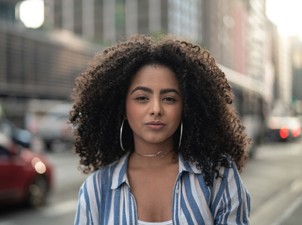 woman standing on a street corner