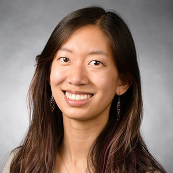 headshot of Anna Li against a grey background headshot of Anna Li against a grey background