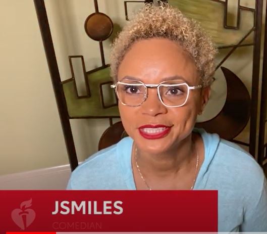 A video frame of comedian J Smiles in a room with home decor.