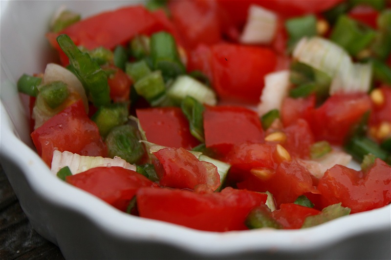 A white dish with salsa